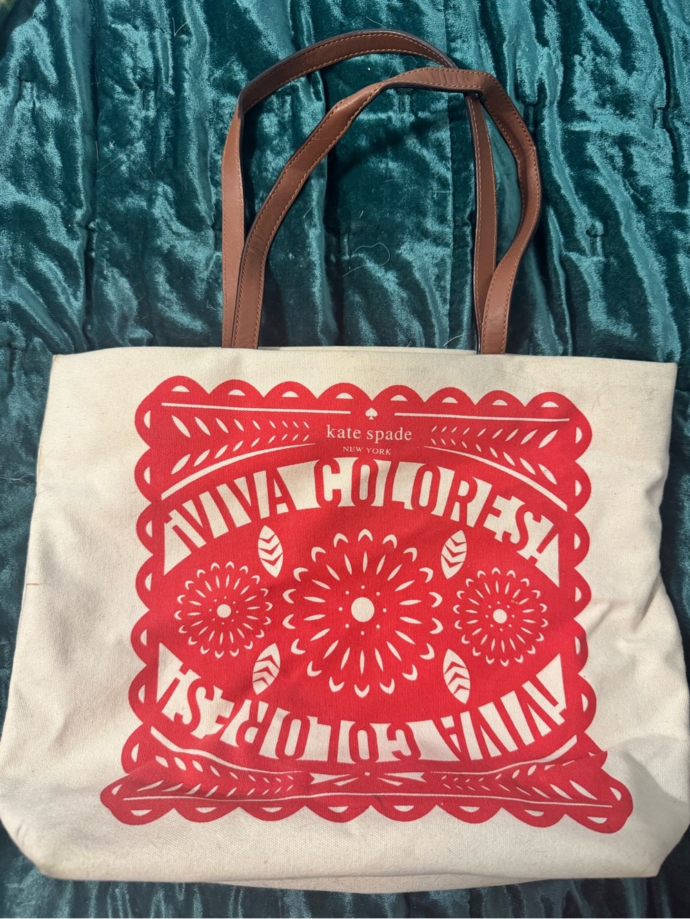 kate spade cream canvas tote with red graphic and brown straps